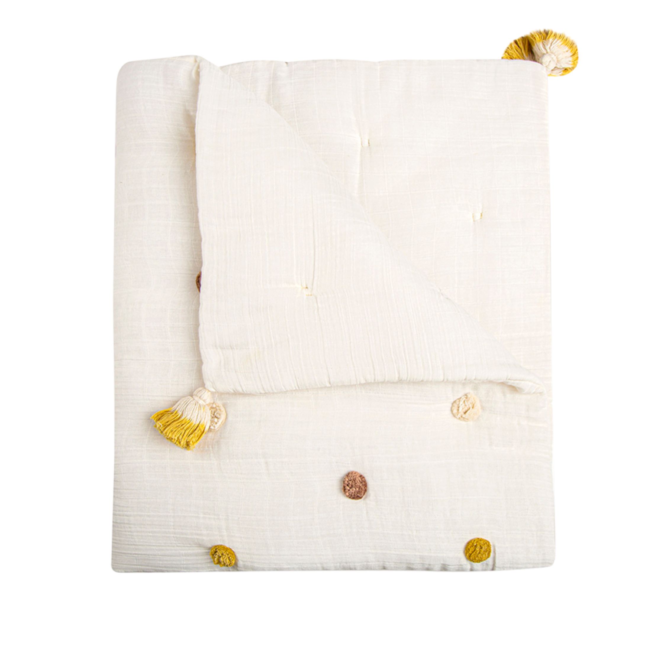 White pom pom blanket on white background